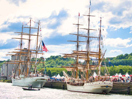 ROUEN, FRANCE - JUNE 8, 2019. Aerial view of Armada exhibition greatest sailboats at Rouen dock on Seine river. International meeting for biggest old schooners and frigates ship in world.のeditorial素材