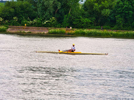 YAINVILLE, FRANCE, JULY Circa, 2019. Boat coxed rowers rowing on the Seine river during Armada...