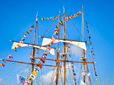 Vintage sailing ship mast ropes and tackle, Tall ship rigging mast detail, blue sky backgroundのeditorial素材