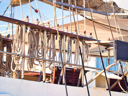 Nautical tackles and equipment of the old tall ship. Rigging ropes and rope ladder on the mast of...