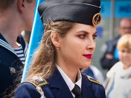 ROUEN, FRANCE - JUNE Circa, 2019. Unidentified Sailors parade in streets at the festival of the Navy., Walking, playing music. Armada, most important sailboats meeting in the world with schonners, frigates, navy.のeditorial素材