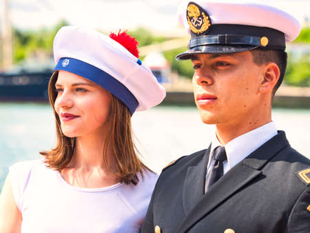 ROUEN, FRANCE - JUNE Circa, 2019. Unidentified attractive crew member with uniform on the top deck of a cruise ship schooner at Armada exhition in Franceのeditorial素材