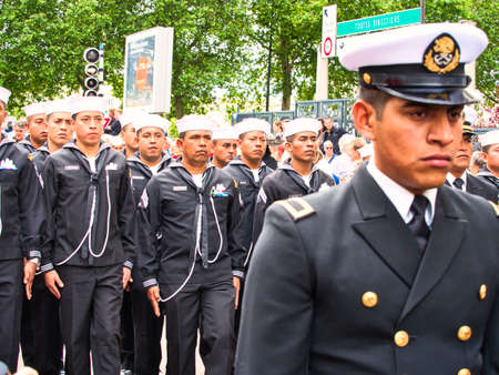 ROUEN, FRANCE - JUNE Circa, 2019. Unidentified Sailors parade in streets at the festival of the Navy., Walking, playing music. Armada, most important sailboats meeting in the world with schonners, frigates, navy.のeditorial素材
