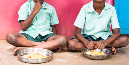 PUDUCHERRY, TAMIL NADU, INDIA - DECEMBER Circa, 2018. Unidentified poor classmates children with...