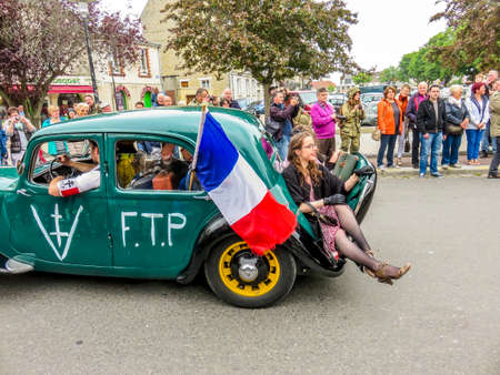 SAINTE MERE L'EGLISE, FRANCE - JUNE 6, 2019. Celebration of the D-DAY, armed landing, end of world war two in Normandy, with help of allied countries. Traction car, with Lorraine cross, deportation NNのeditorial素材
