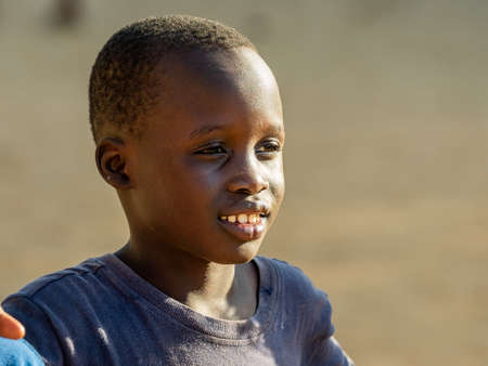 MBOUR, SENEGAL - JANUARY Circa, 2021. Portrait of unidentified young senegalese child, looking at...