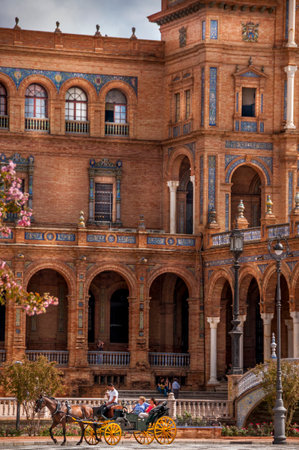 SEVILLE, SPAIN - JUNE Circa, 2020. Plaza de Espana. Square with the Northern Tower view, the canal and rowing boats in Seville City Center, Spain.のeditorial素材