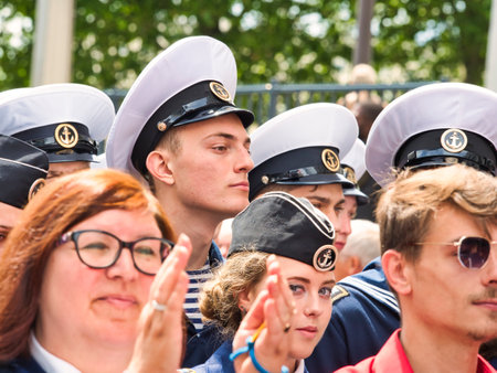 ROUEN, FRANCE - JUNE Circa, 2019. Unidentified Sailors parade in streets at the festival of the Navy., walking, playing music. Armada, most important sailboats meeting in the world with schonners, frigates, navy.のeditorial素材
