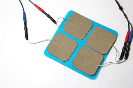 set of medical electrodes patches with electric wires on white background