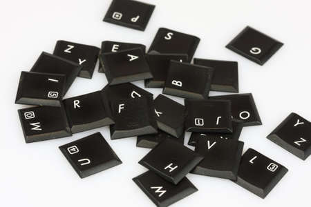 Scattered keyboard letters on white backgroundの写真素材