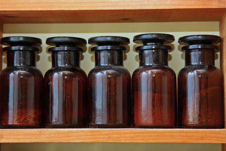 Laboratory bottles in shelveの写真素材