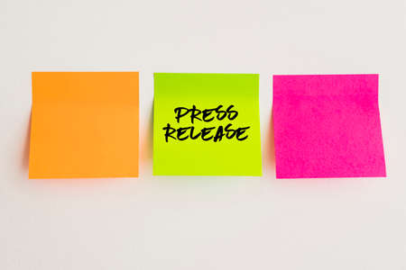Press Release, sticky note, orange, pinky and green adhesive note quote conceptの写真素材