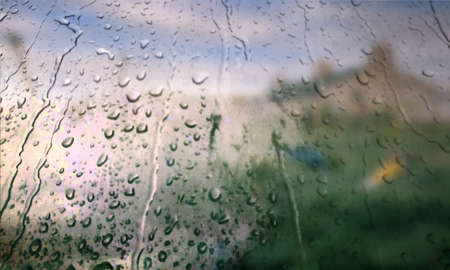 Background with rain drops close up. Rain drops on outdoor window, Closeup view transparent water...