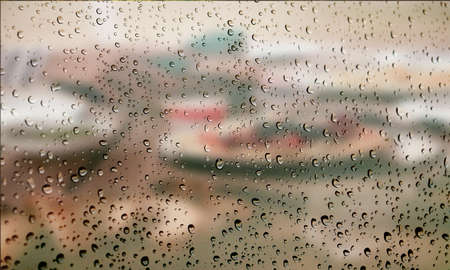Background with rain drops close up. Rain drops on outdoor window, Closeup view transparent water...
