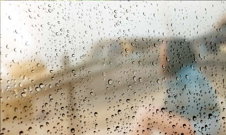 Background with rain drops close up. Rain drops on outdoor window, Closeup view transparent water...