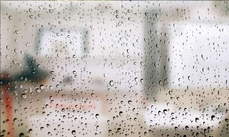Background with rain drops close up. Rain drops on outdoor window, Closeup view transparent water...