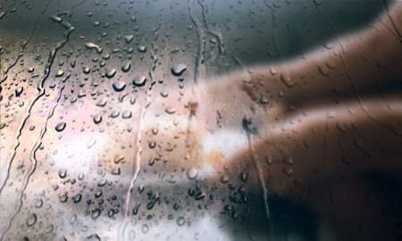 Background with rain drops close up. Rain drops on outdoor window, Closeup view transparent water drops on glass surface, humid water backdrop, blurred background with copy space for your textの写真素材