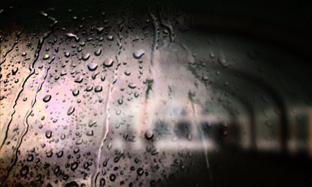Background with rain drops close up. Rain drops on outdoor window, Closeup view transparent water drops on glass surface, humid water backdrop, blurred background with copy space for your textの写真素材