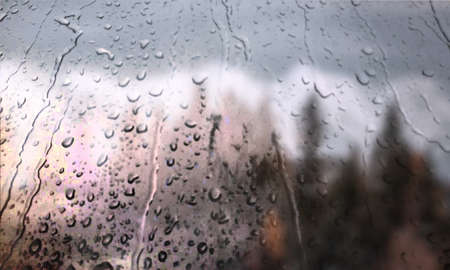 Background with rain drops close up. Rain drops on outdoor window, Closeup view transparent water...