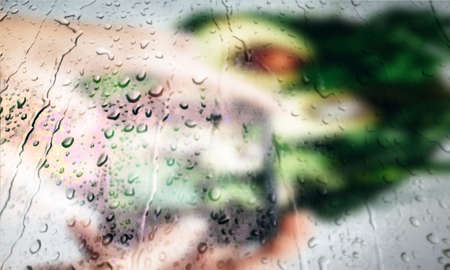 Background with rain drops close up. Rain drops on outdoor window, Closeup view transparent water drops on glass surface, humid water backdrop, blurred background with copy space for your textの写真素材