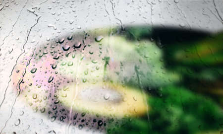 Background with rain drops close up. Rain drops on outdoor window, Closeup view transparent water drops on glass surface, humid water backdrop, blurred background with copy space for your textの写真素材