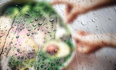Background with rain drops close up. Rain drops on outdoor window, Closeup view transparent water drops on glass surface, humid water backdrop, blurred background with copy space for your textの写真素材