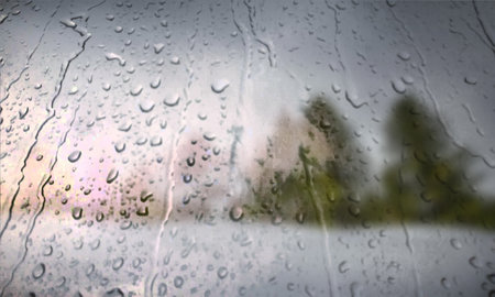 Background with rain drops close up. Rain drops on outdoor window, Closeup view transparent water drops on glass surface, humid water backdrop, blurred background with copy space for your textの写真素材