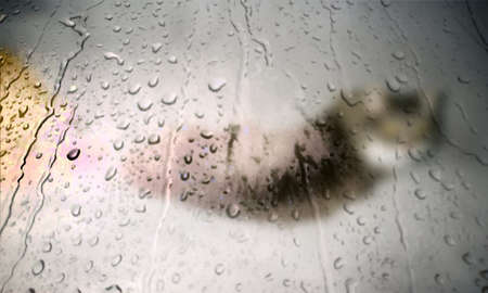 Background with rain drops close up. Rain drops on outdoor window, Closeup view transparent water drops on glass surface, humid water backdrop, blurred background with copy space for your textの写真素材