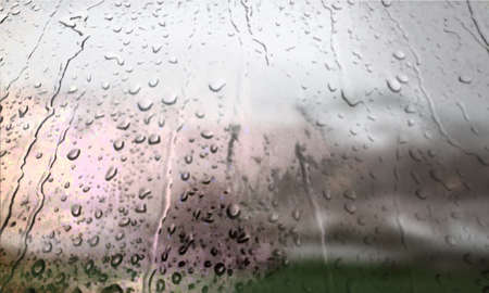 Background with rain drops close up. Rain drops on outdoor window, Closeup view transparent water drops on glass surface, humid water backdrop, blurred background with copy space for your textの写真素材