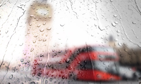 Background with rain drops close up. Rain drops on outdoor window, Closeup view transparent water drops on glass surface, humid water backdrop, blurred background with copy space for your textの写真素材