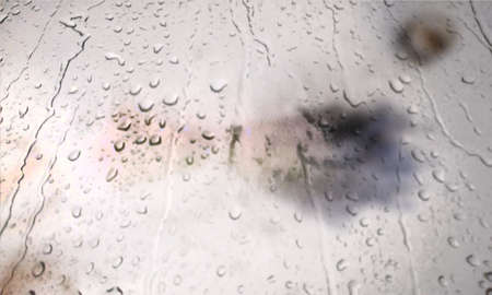 Background with rain drops close up. Rain drops on outdoor window, Closeup view transparent water drops on glass surface, humid water backdrop, blurred background with copy space for your textの写真素材