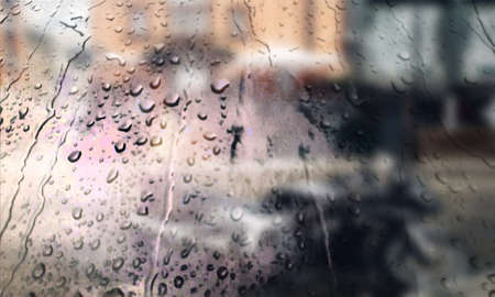 Background with rain drops close up. Rain drops on outdoor window, Closeup view transparent water drops on glass surface, humid water backdrop, blurred background with copy space for your textの写真素材