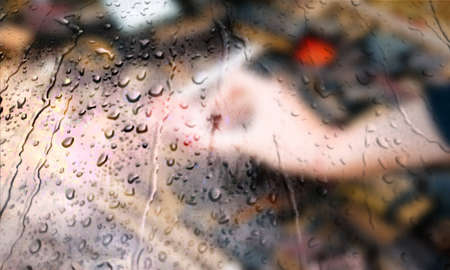 Background with rain drops close up. Rain drops on outdoor window, Closeup view transparent water drops on glass surface, humid water backdrop, blurred background with copy space for your textの写真素材