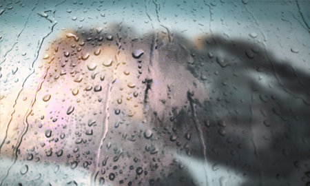 Background with rain drops close up. Rain drops on outdoor window, Closeup view transparent water drops on glass surface, humid water backdrop, blurred background with copy space for your textの写真素材