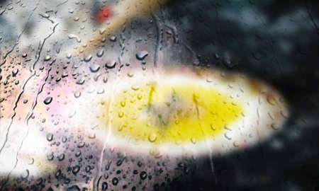 Background with rain drops close up. Rain drops on outdoor window, Closeup view transparent water drops on glass surface, humid water backdrop, blurred background with copy space for your textの写真素材