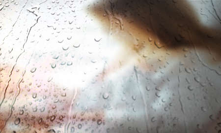 Background with rain drops close up. Rain drops on outdoor window, Closeup view transparent water drops on glass surface, humid water backdrop, blurred background with copy space for your textの写真素材