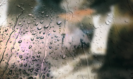 Background with rain drops close up. Rain drops on outdoor window, Closeup view transparent water drops on glass surface, humid water backdrop, blurred background with copy space for your textの写真素材