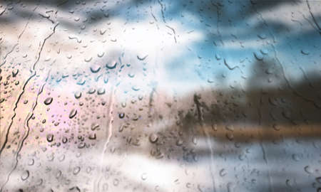 Background with rain drops close up. Rain drops on outdoor window, Closeup view transparent water drops on glass surface, humid water backdrop, blurred background with copy space for your textの写真素材