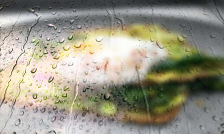 Background with rain drops close up. Rain drops on outdoor window, Closeup view transparent water drops on glass surface, humid water backdrop, blurred background with copy space for your textの写真素材