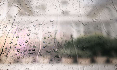 Background with rain drops close up. Rain drops on outdoor window, Closeup view transparent water drops on glass surface, humid water backdrop, blurred background with copy space for your textの写真素材