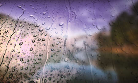 Background with rain drops close up. Rain drops on outdoor window, Closeup view transparent water drops on glass surface, humid water backdrop, blurred background with copy space for your textの写真素材