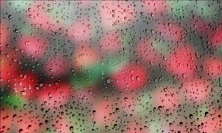 Background with rain drops close up. Rain drops on outdoor window, Closeup view transparent water drops on glass surface, humid water backdrop, blurred background with copy space for your textの写真素材