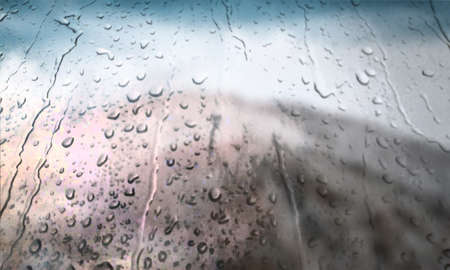 Background with rain drops close up. Rain drops on outdoor window, Closeup view transparent water drops on glass surface, humid water backdrop, blurred background with copy space for your textの写真素材