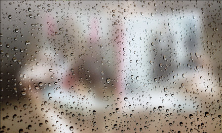 Background with rain drops close up. Rain drops on outdoor window, Closeup view transparent water drops on glass surface, humid water backdrop, blurred background with copy space for your textの写真素材