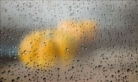 Background with rain drops close up. Rain drops on outdoor window, Closeup view transparent water...
