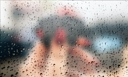 Background with rain drops close up. Rain drops on outdoor window, Closeup view transparent water drops on glass surface, humid water backdrop, blurred background with copy space for your textの写真素材