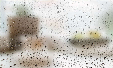 Background with rain drops close up. Rain drops on outdoor window, Closeup view transparent water drops on glass surface, humid water backdrop, blurred background with copy space for your textの写真素材
