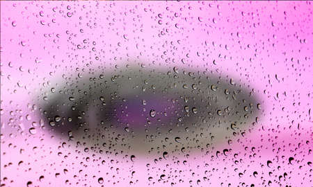 Background with rain drops close up. Rain drops on outdoor window, Closeup view transparent water drops on glass surface, humid water backdrop, blurred background with copy space for your textの写真素材