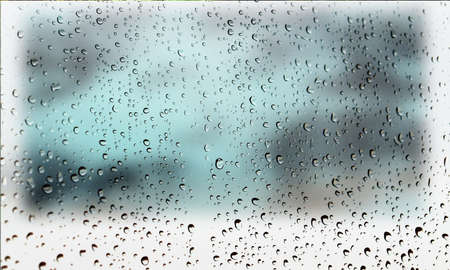 Background with rain drops close up. Rain drops on outdoor window, Closeup view transparent water drops on glass surface, humid water backdrop, blurred background with copy space for your textの写真素材