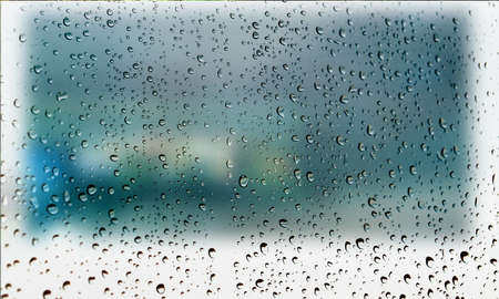Background with rain drops close up. Rain drops on outdoor window, Closeup view transparent water drops on glass surface, humid water backdrop, blurred background with copy space for your textの写真素材